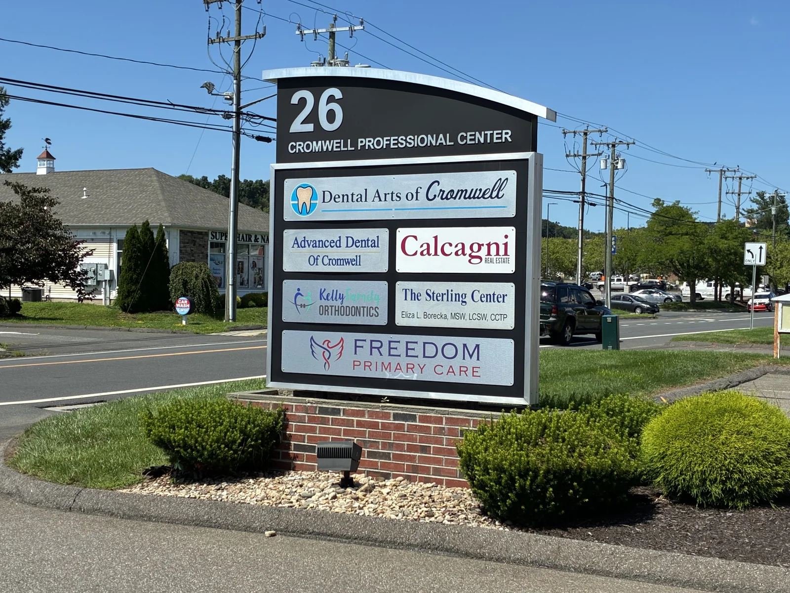 Roadside sign for 26 Cromwell Professional Center listing Freedom Primary Care